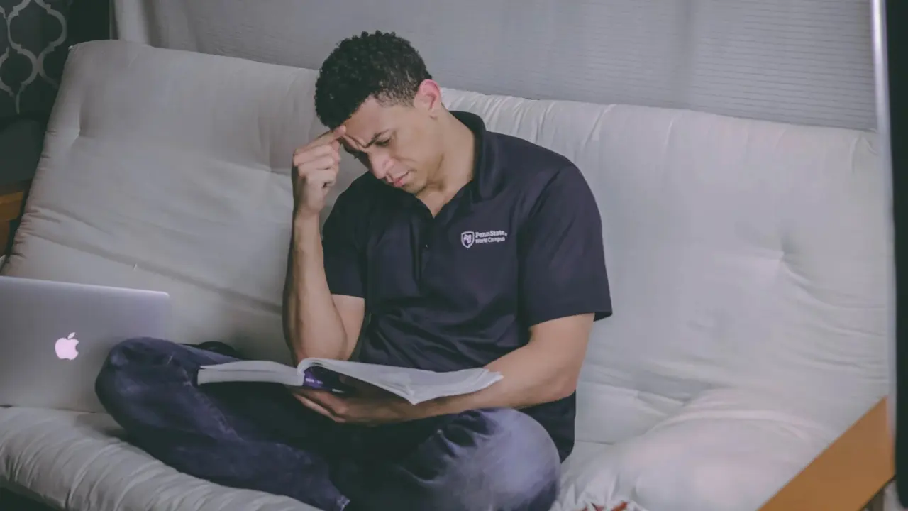 Marketer reading a guide on a laptop