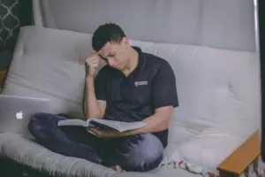 Marketer reading a guide on a laptop