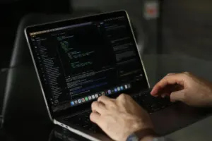 Developer coding on a laptop