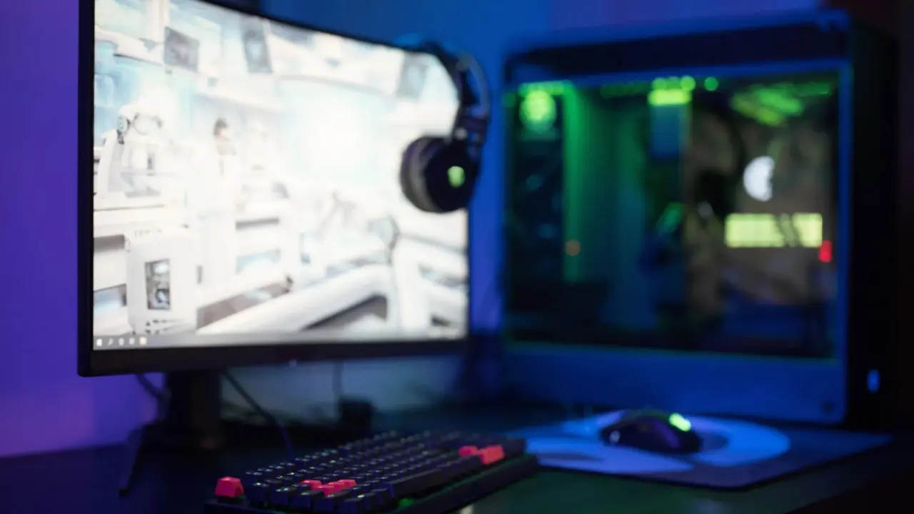 Gaming PC and console on a desk